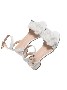 Girl white formal shoes with flowers on top