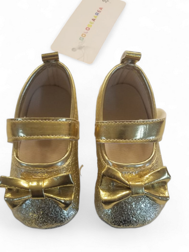 Gold baby shoes